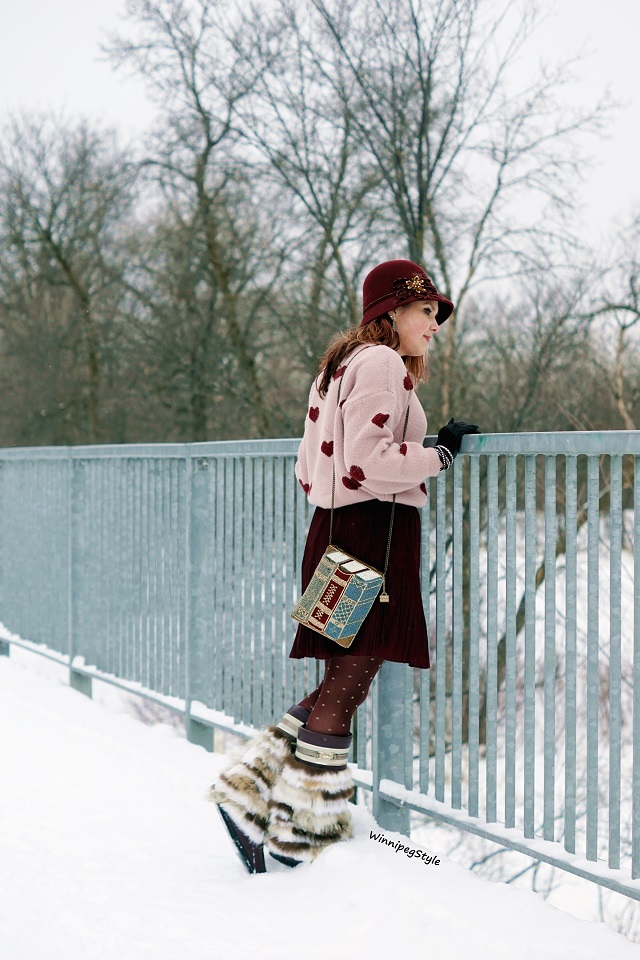 Winnipeg Style Fashion style blog, Personal shopping consultant, Chicwish cropped heart print sweater jumper, Forever 21 pleated satin short skirt, Mary Frances Accessories Best Seller book beaded clutch bag crossbody, Julie Pedersen designer urban mukluks muckies mocassin boots, Canadian winter chic style, 2019, burgundy and baby pink
